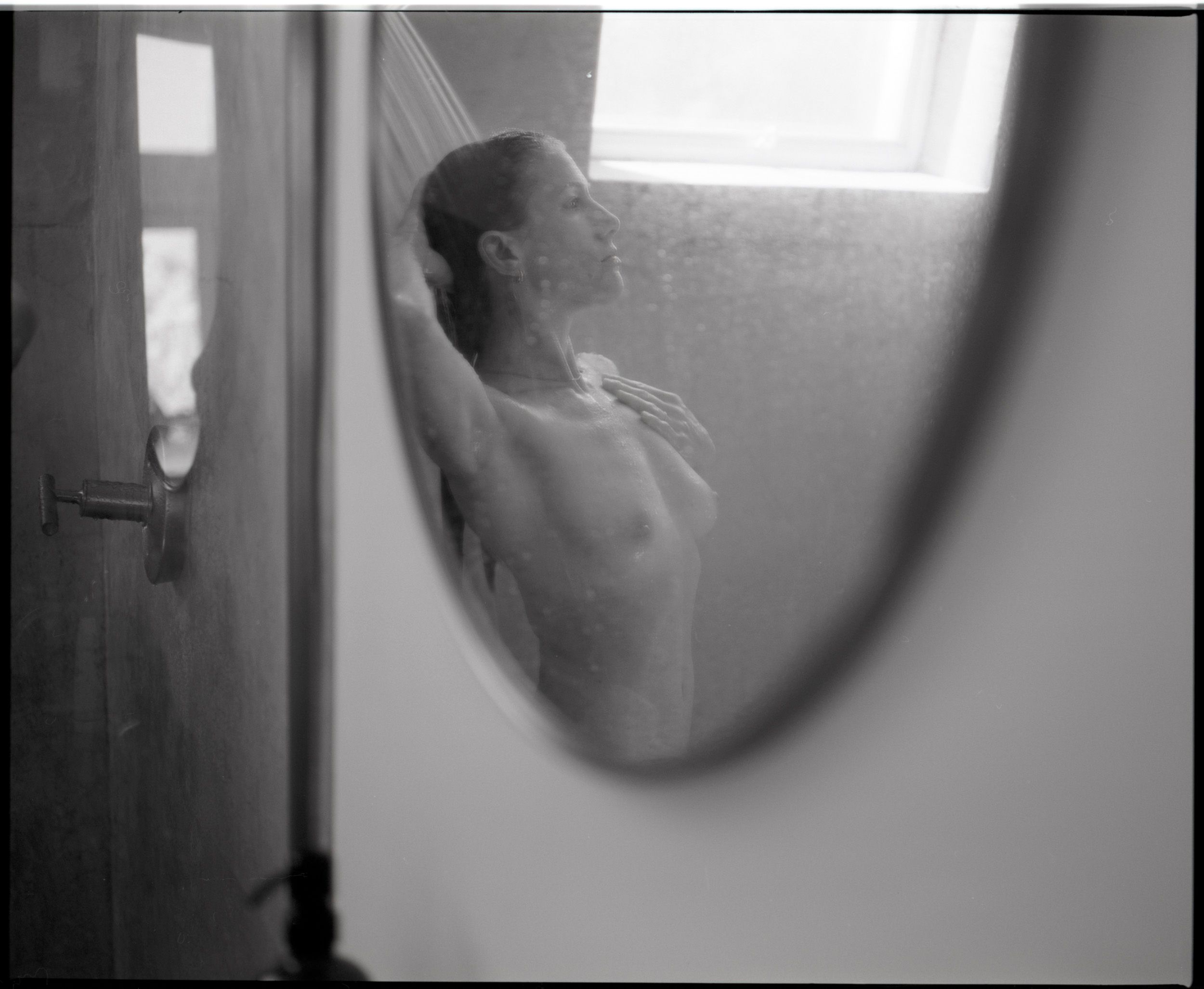 Black and white analog photograph shot on Mamiya RZ67 Pro II and Ilford Delta 400 Professional with Sekor 90mm in Joshua Tree, CA by TheAnalogPhotographer (United States). [Art Nude (NSFW)]