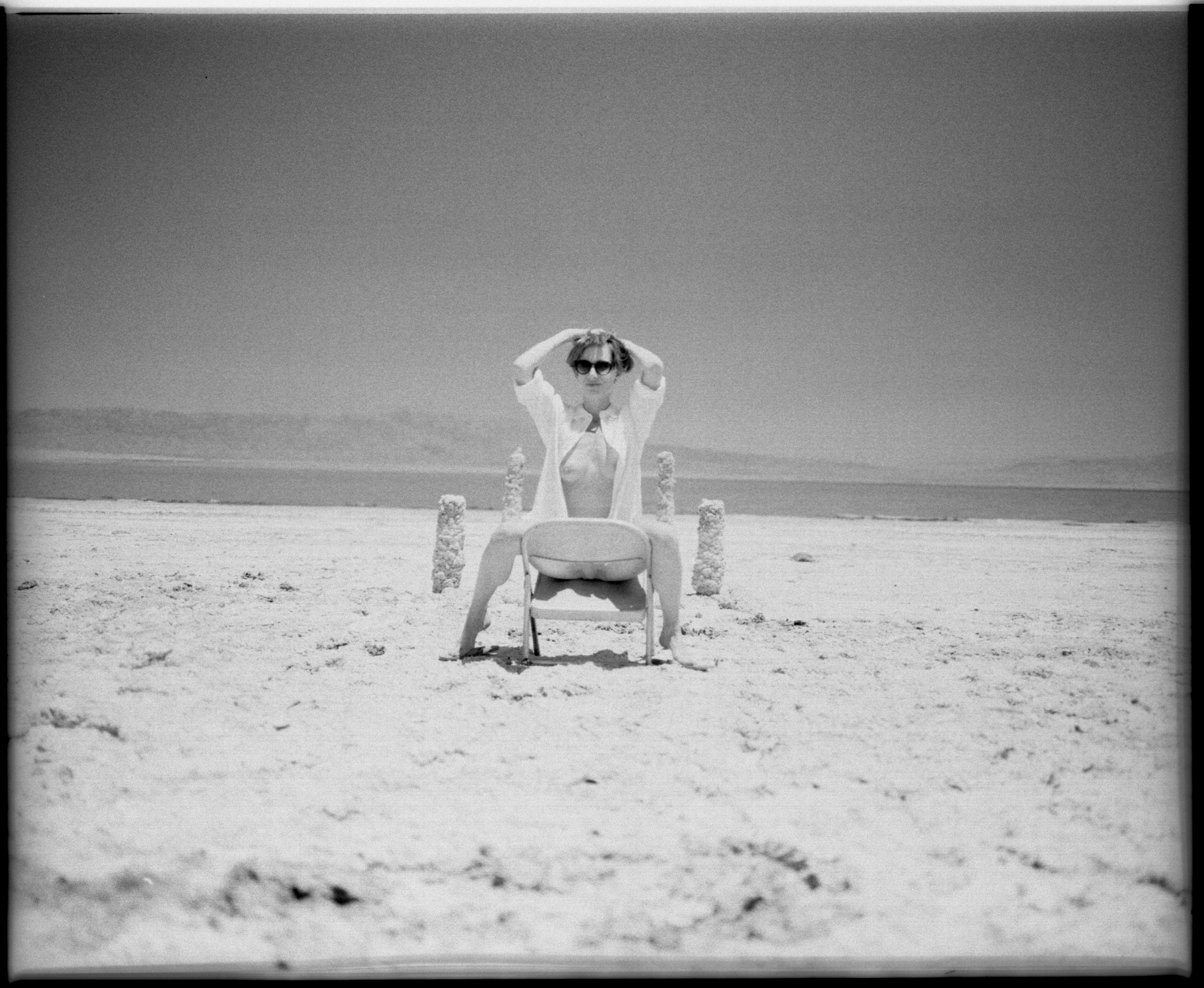 Black and white analog photograph shot on Mamiya RZ67 Pro II and Ilford Delta 400 Professional with Sekor 90mm in Salton Sea, CA by TheAnalogPhotographer (United States). [Art Nude (NSFW)]