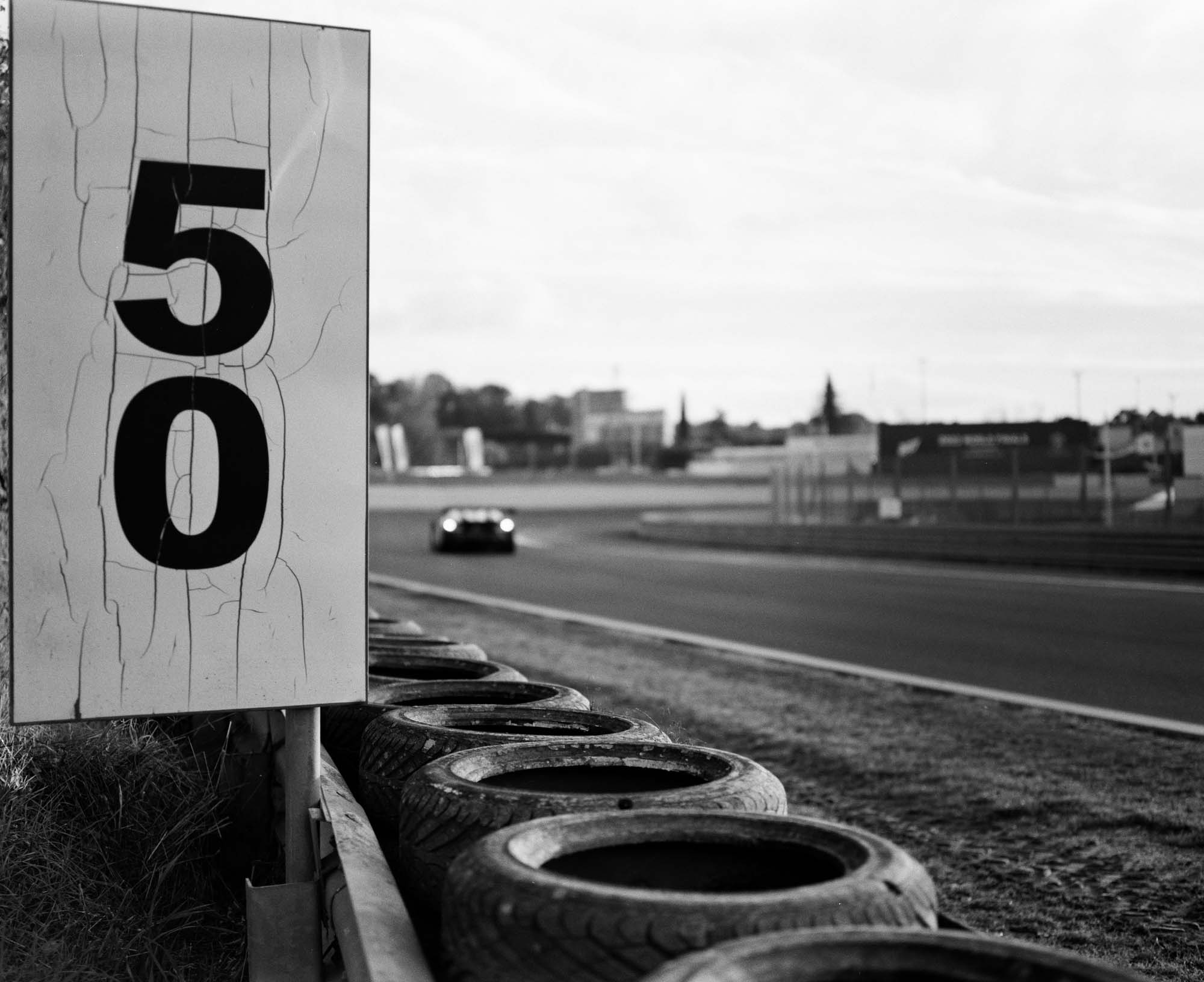 Black and white analog photograph shot on Mamiya RZ67 Pro II and Ilford Hp5 Plus in Italy by TheAnalogPhotographer (United States). [Automotive]
