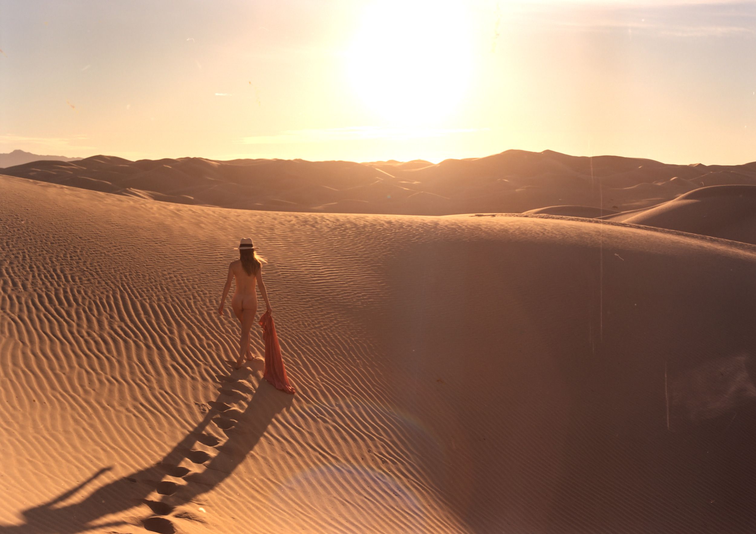 Color analog photograph shot on Mamiya RZ67 Pro II and Kodak Vision3 250D with Sekor 50mm f4.5 in Imperial Sand Dunes by TheAnalogPhotographer (United States). [Art Nude (NSFW)]