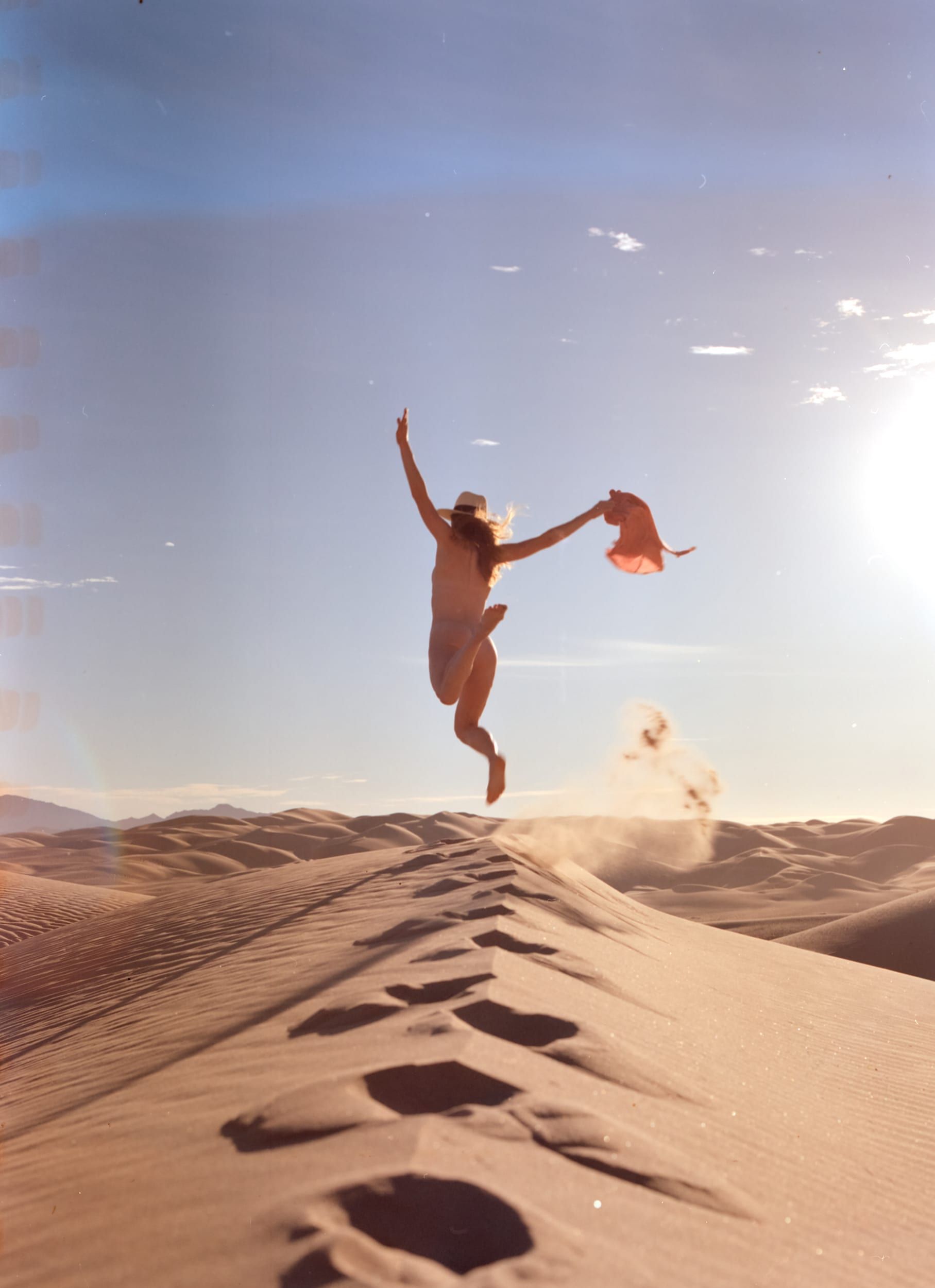 Color analog photograph shot on Mamiya RZ67 Pro II and Kodak Vision3 250D with Sekor 90mm in Imperial Sand Dunes by TheAnalogPhotographer (United States). [Art Nude (NSFW)]