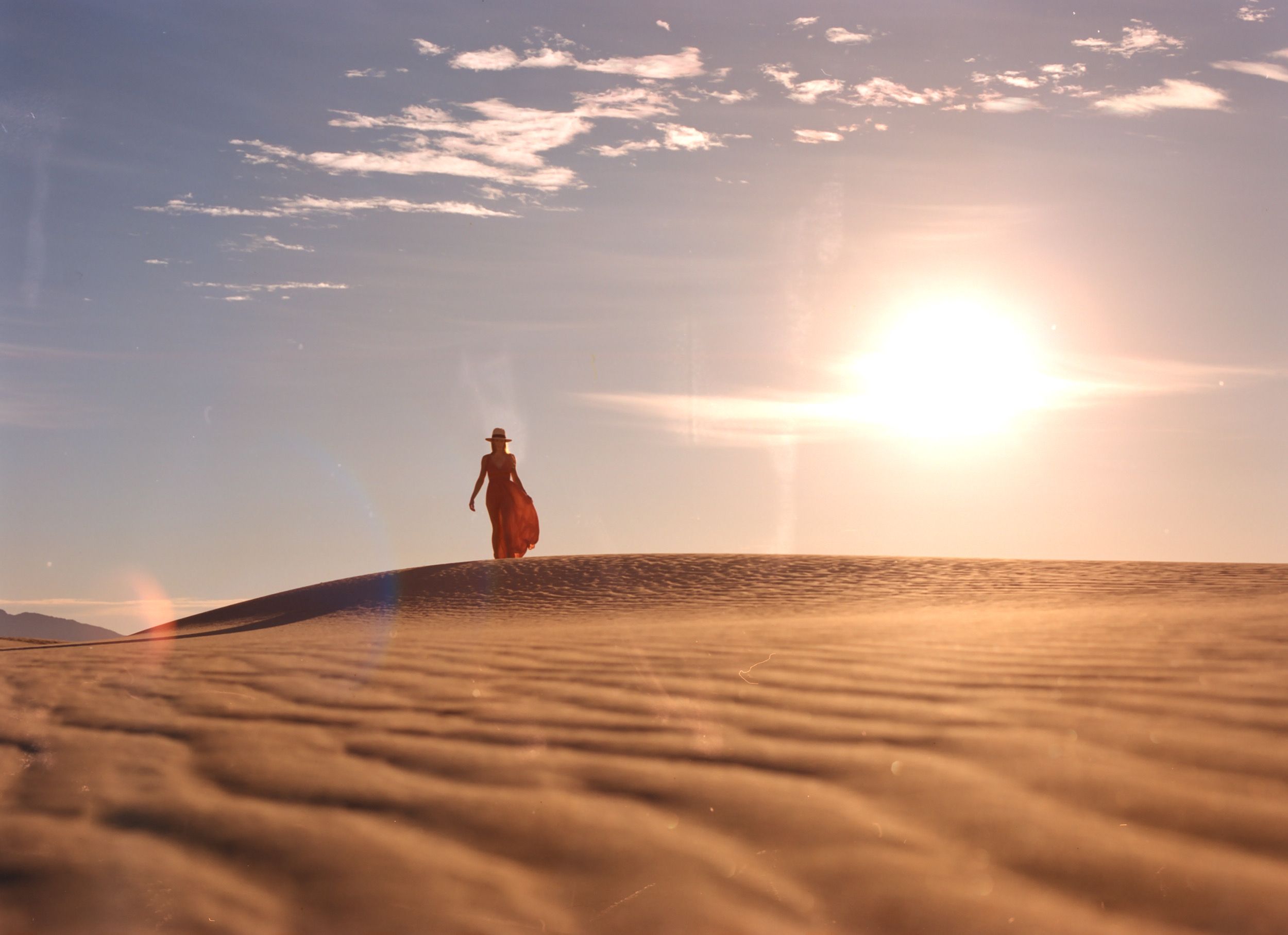 Color analog photograph shot on Mamiya RZ67 Pro II and Kodak Vision3 250D with Sekor 50mm f4.5 in Imperial Sand Dunes by TheAnalogPhotographer (United States). [Fashion]