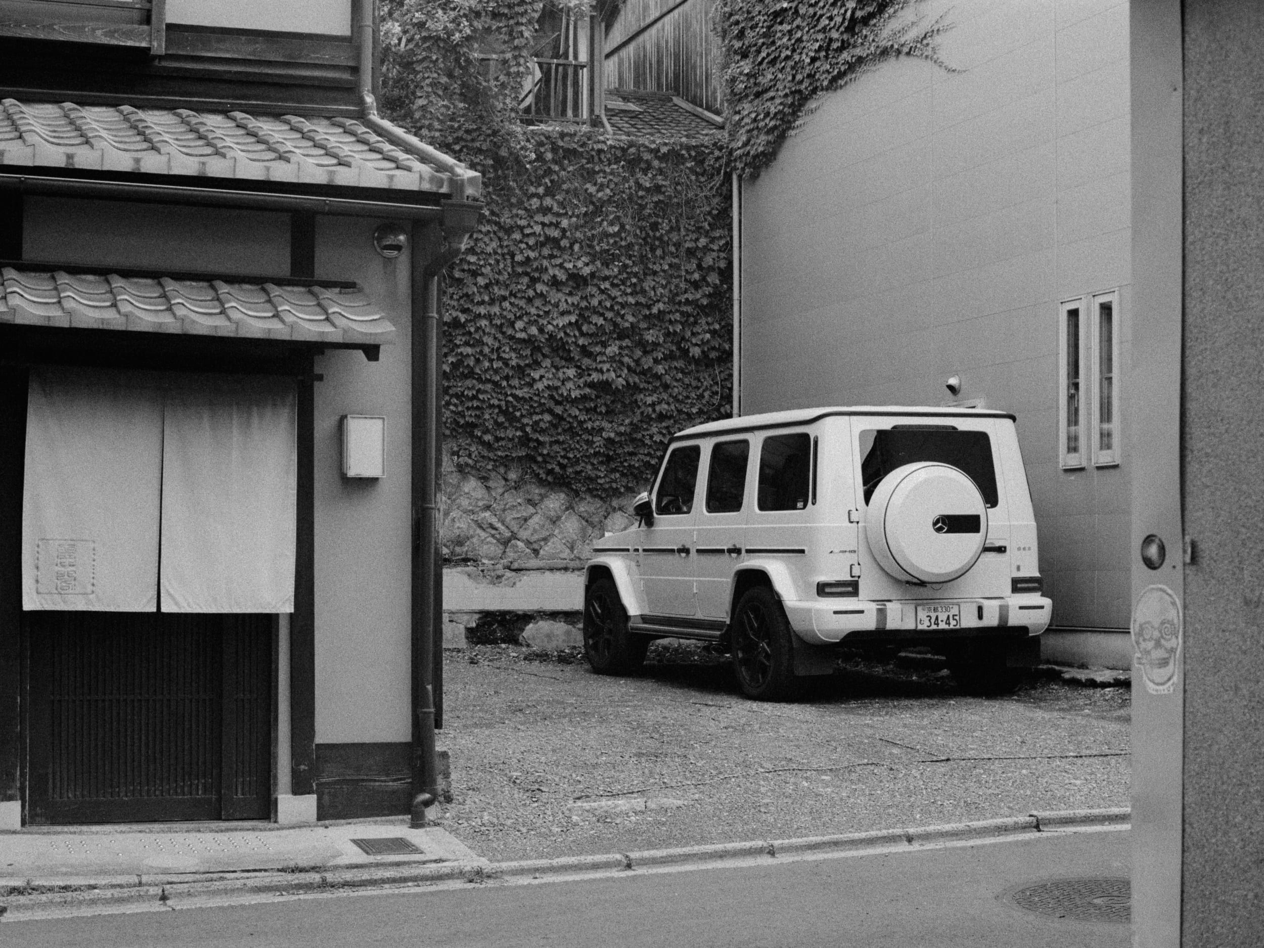 Black and white analog photograph shot on Contax RX and Ilford Hp5 Plus with Carl Zeiss Planar T* 50mm f1.4 in Kyoto, Japan by Jack_von_Linden (United States). [Editorial]