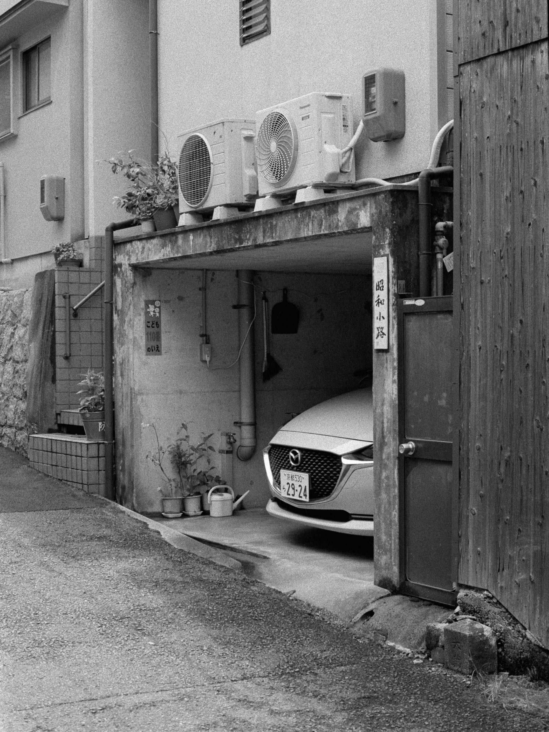 Black and white analog photograph shot on Contax RX and Ilford Hp5 Plus with Carl Zeiss Planar T* 50mm f1.4 in Kyoto, Japan by Jack_von_Linden (United States). [Editorial]