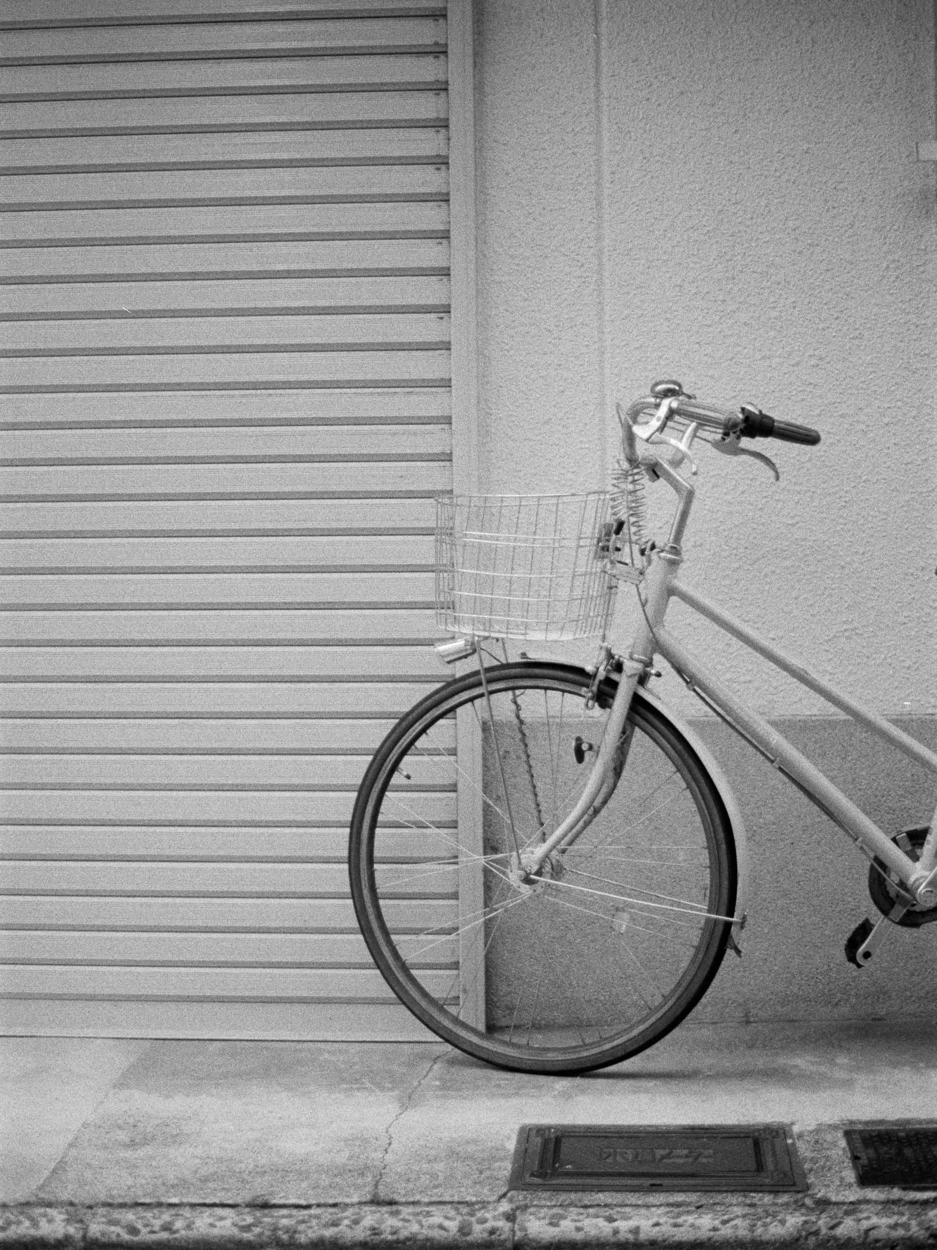 Black and white analog photograph shot on Contax RX and Ilford Hp5 Plus with Carl Zeiss Planar T* 50mm f1.4 in Kyoto, Japan by Jack_von_Linden (United States). [Editorial]
