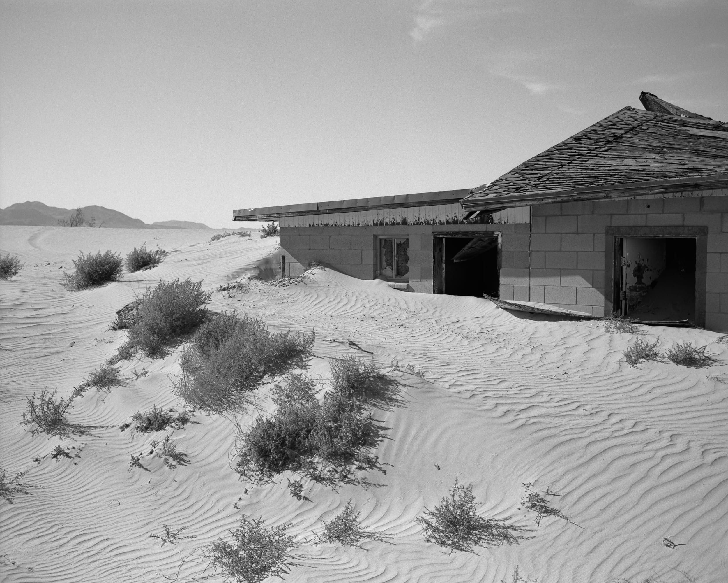 Black and white analog photograph shot on Mamiya 7ii and Kodak Professional T-Max 400 with 80mm f4 in Newberry Springs, California by Jack_von_Linden (United States). [Landscape]