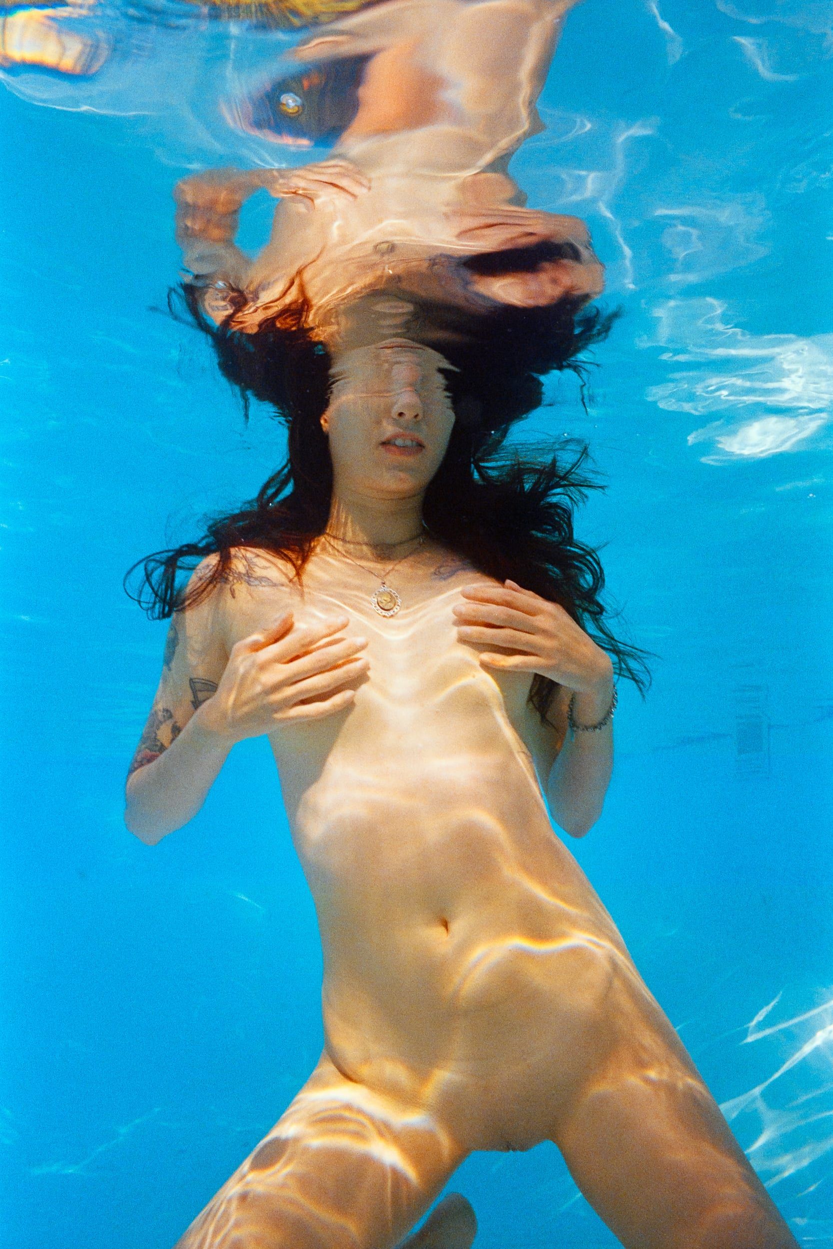 Color analog photograph shot on Nikonos V and Kodak Professional Portra 800 with 35mm f2.5 in Columbus, Ohio by Jack_von_Linden (United States). [Underwater]